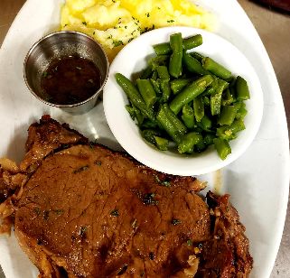 Prime Rib - 12 or 16oz Prime Rib dinners with your choice of potato, seasoned green.