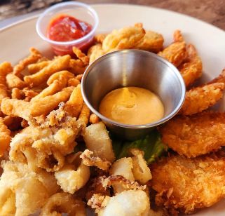 Seafood Platter - Fried clams, fried oysters, fried shrimp and calamari! Served with out housemade boom boom sauce.